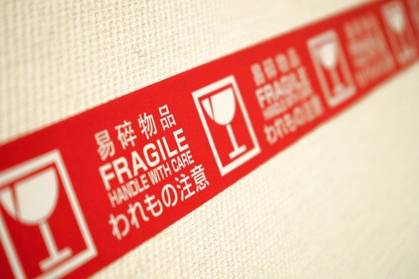 A label showing to carry fragile items with care